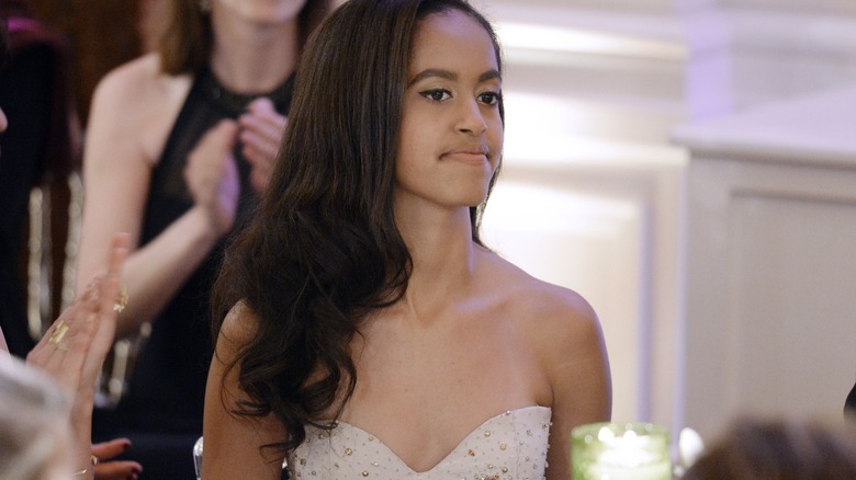 Malia Obama looking off to the side