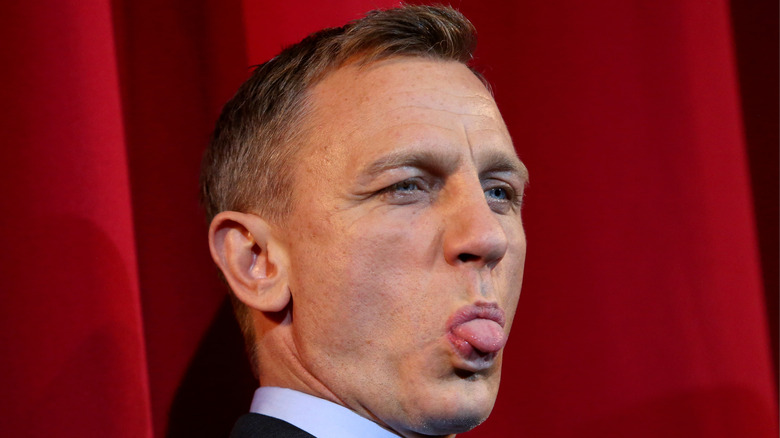 Daniel Craig sticks his tongue out