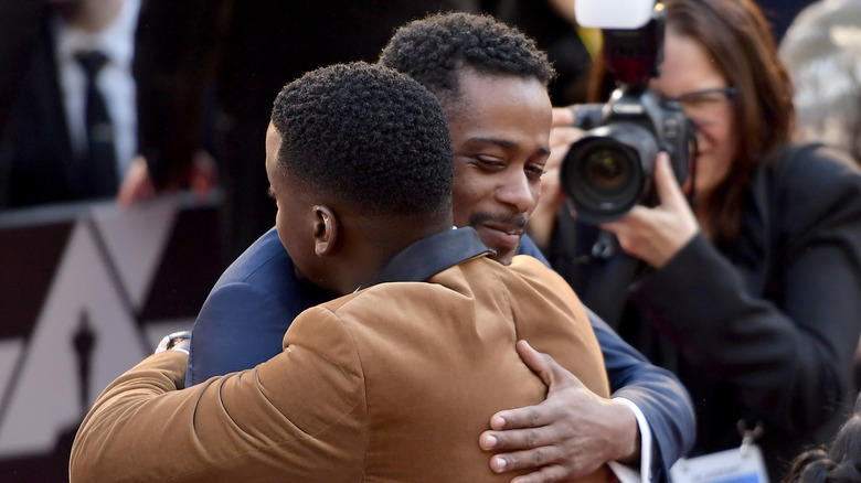 Daniel Kaluyya and LaKeith Stanfield hugging