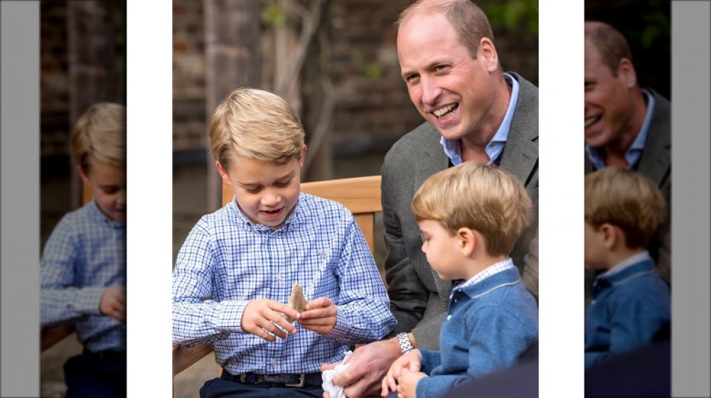 Prince George with his gift from David Attenborough