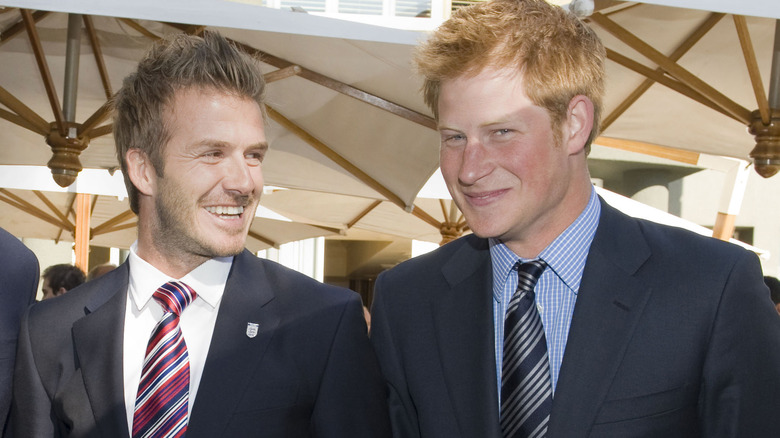 Prince Harry and David Beckham smiling