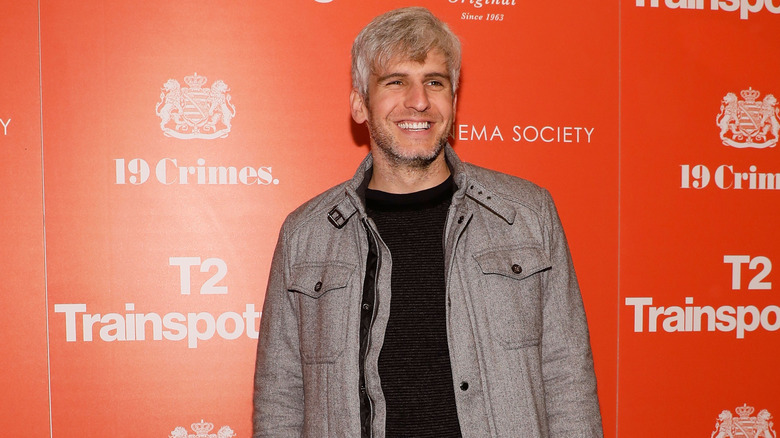 Max Joseph posing on red carpet