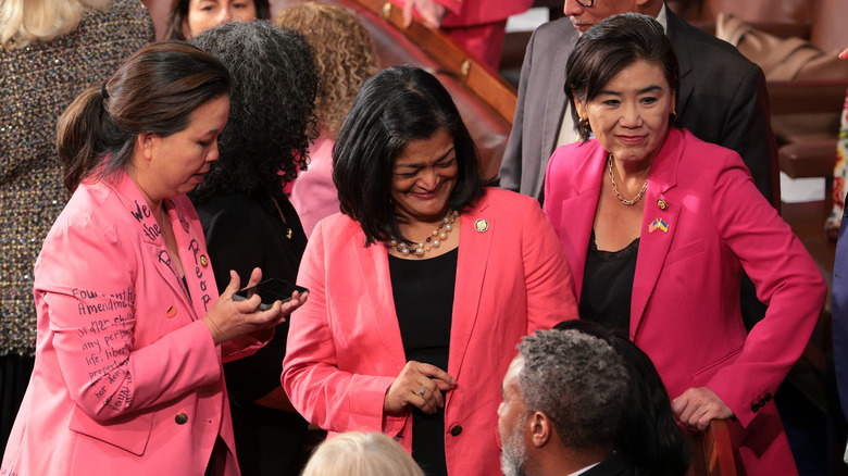 Representatives wearing pink jackets