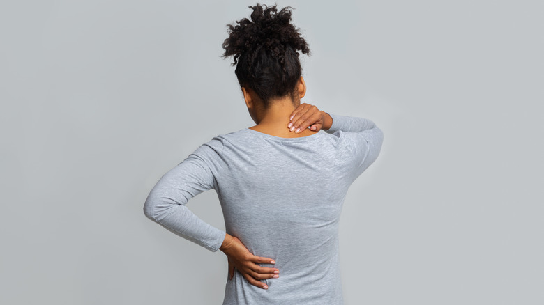 Woman with neck and back pain