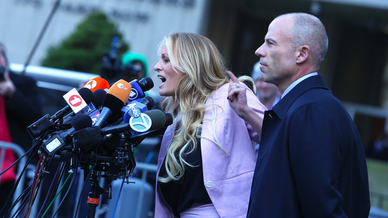 Stormy Daniels speaks into microphones outside of court