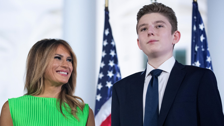 Melania Trump smiling proudly at her son, Barron Trump