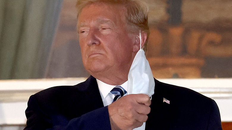 Trump taking off his mask