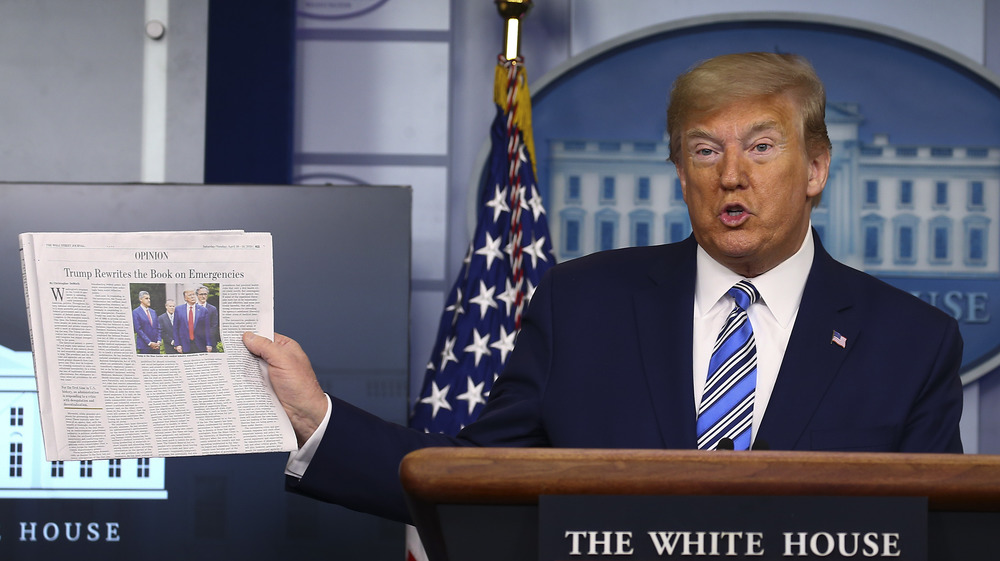 Trump holding a copy of the Wall Street Journal