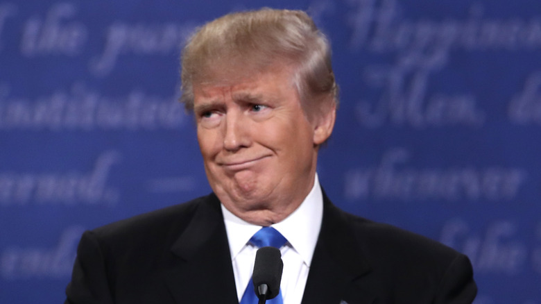 Donald Trump mocks someone with his face