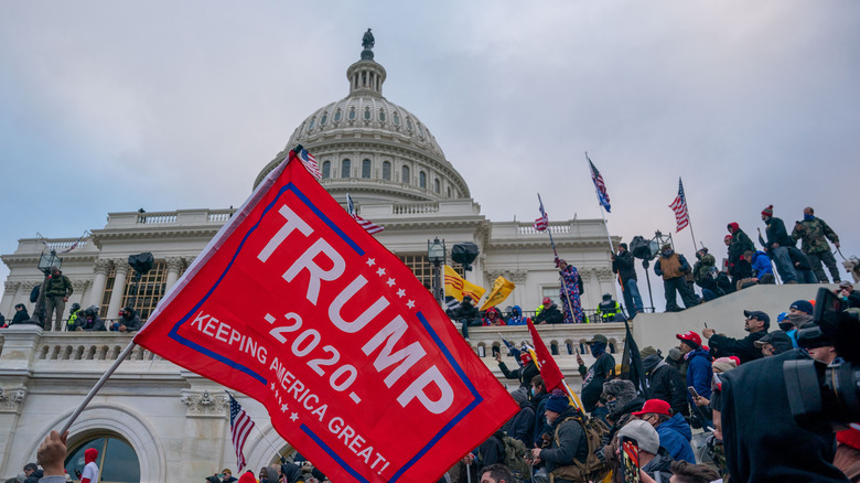 January 6 Trump supporters carrying Trump flags