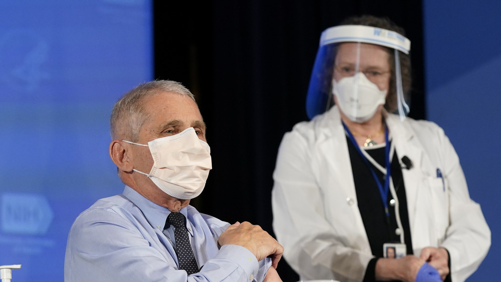 Dr. Fauci getting his vaccine shot in a mask