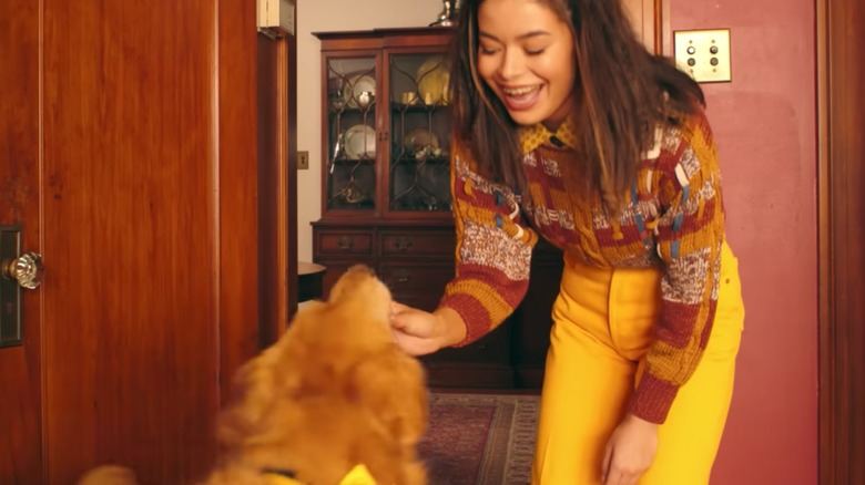 Miranda Cosgrove and a dog in Happier music video