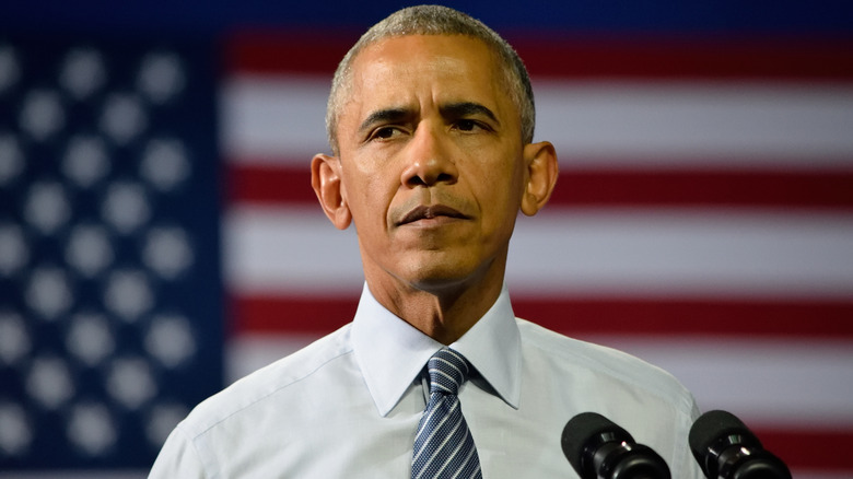 President Barack Obama standing in front of microphone