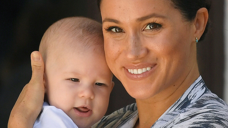 Meghan Markle and Archie cuddle and smile