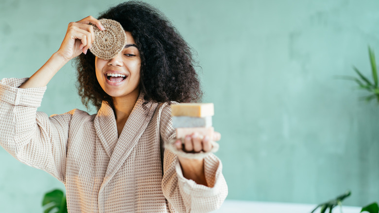 Woman posing with bars of soap 