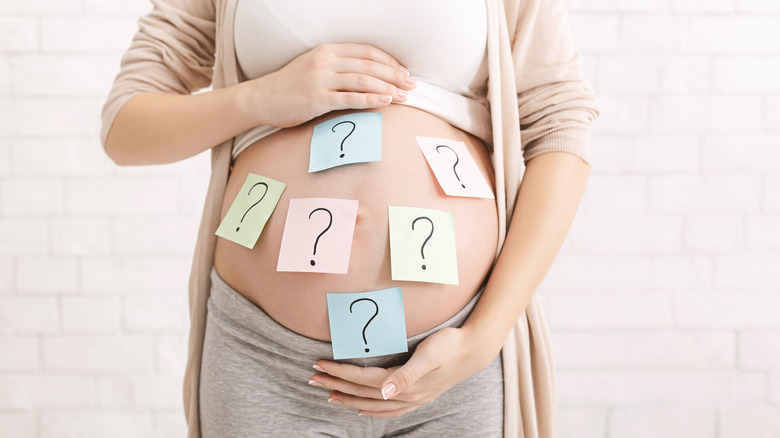 Pregnant woman question marks