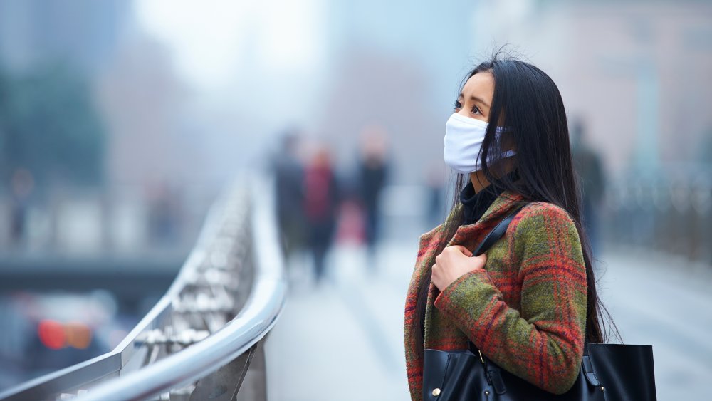 young woman wearing a mask