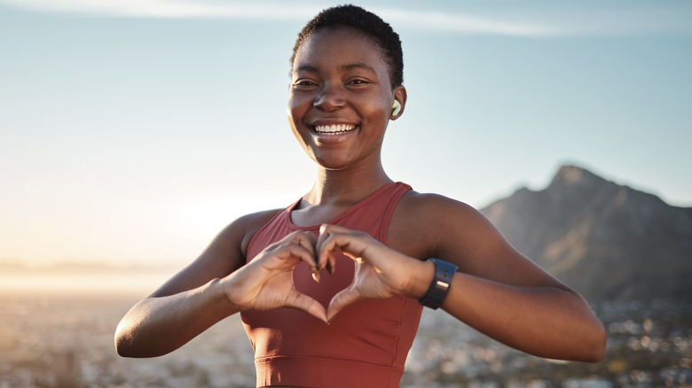 A woman smiling outdoors