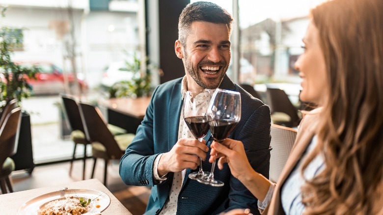 Man and woman drinking wine