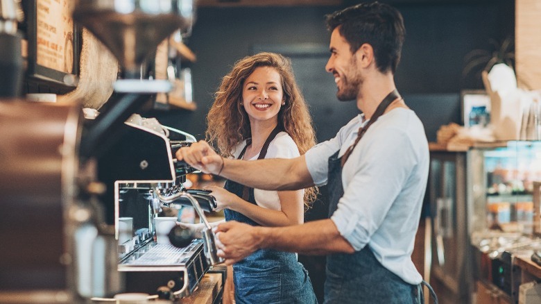 Man and woman working at coffee shop