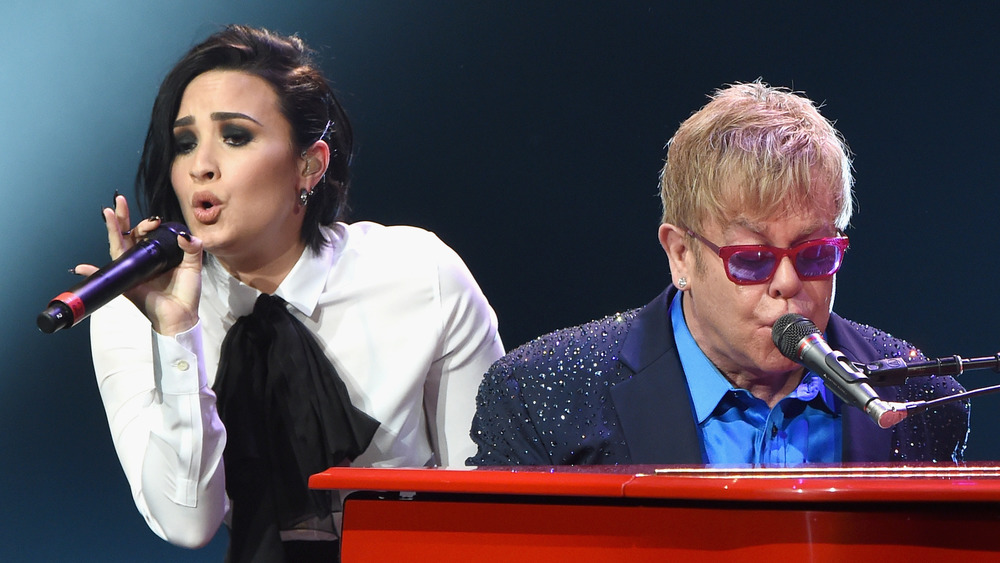 Demi Lovato performing with Elton John