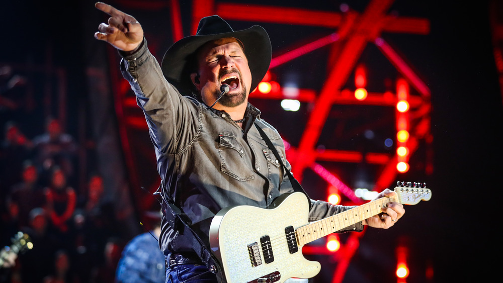 Garth Brooks singing on stage