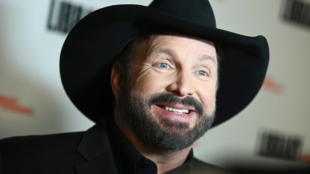 Garth Brooks smiling in cowboy hat