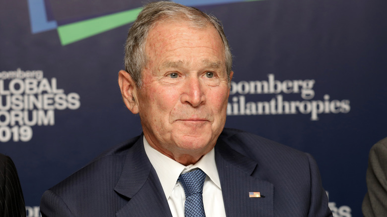 George. W Bush smirking