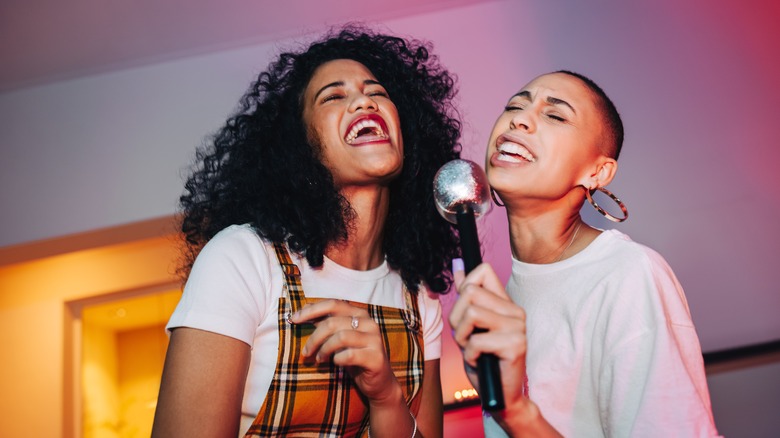 Women singing karaoke