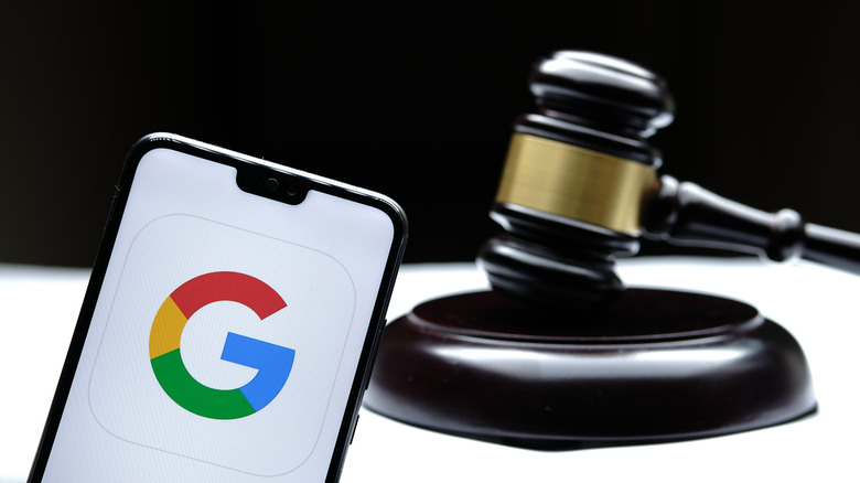 Google logo on a phone with a gavel