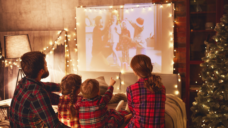 Family watching Christmas movie