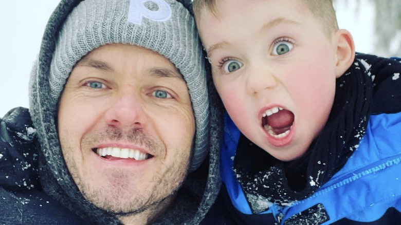 Paul Campbell in snow with son Kingston