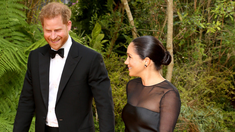 Prince Harry and Meghan smiling