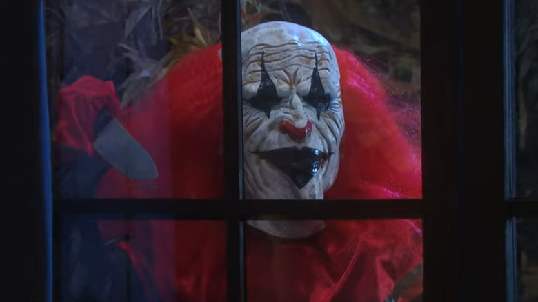 A clown peaks through a window at EJ DiMera on DOOL