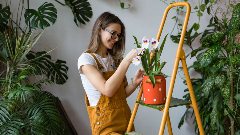 woman smiling near plants