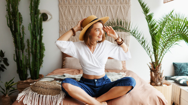 young woman wearing hat