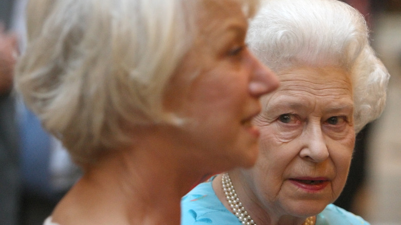 Queen Elizabeth glancing at Helen Mirren knowingly