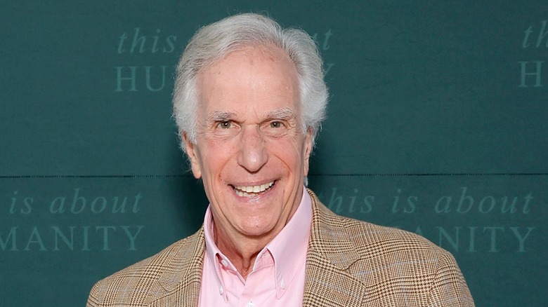 Henry Winkler smiling in a tan blazer