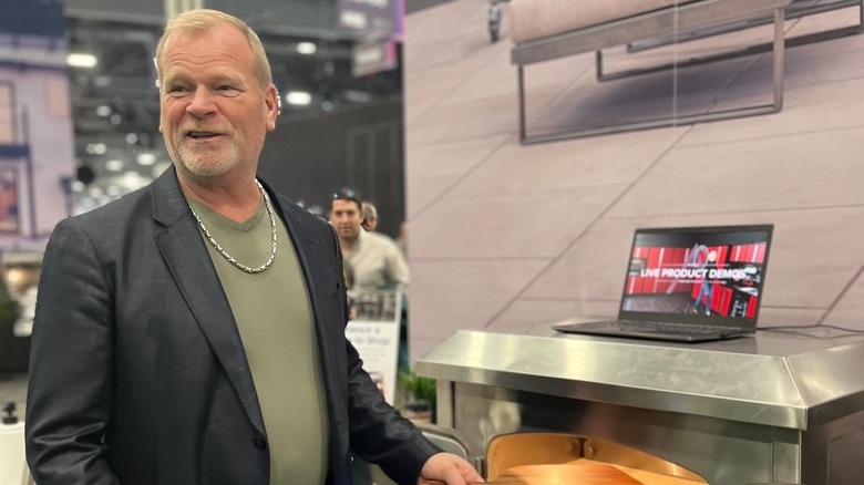 Mike Holmes looking at appliances