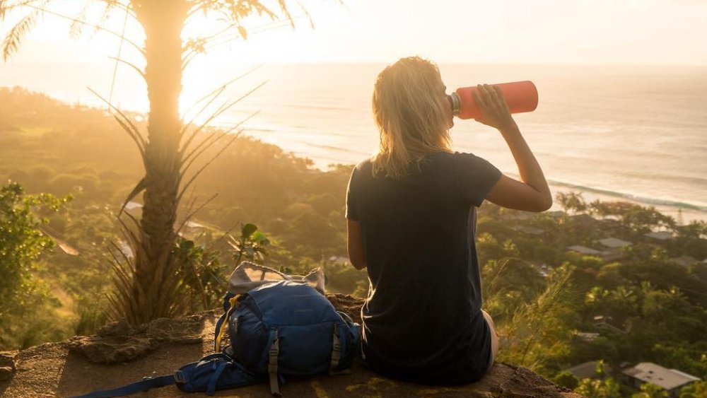 Hydro Flask user on a beach