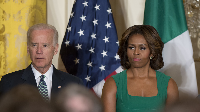 Joe Biden and Michelle Obama frowning