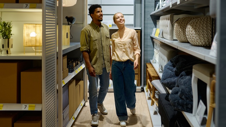 man and woman in furniture store