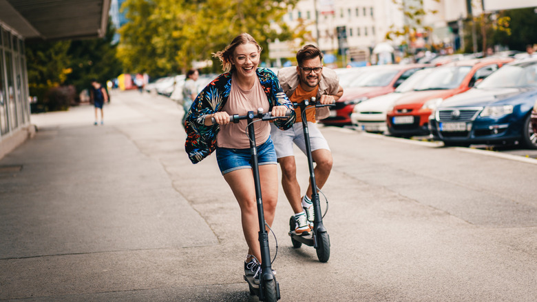 couple scootering around town