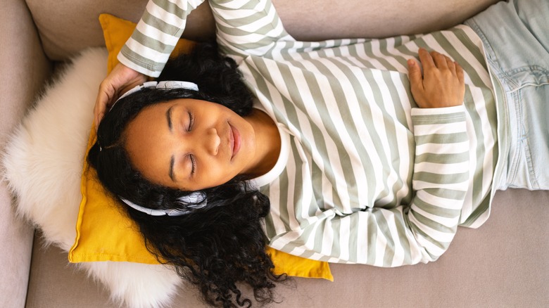 Woman relaxing with headphones on