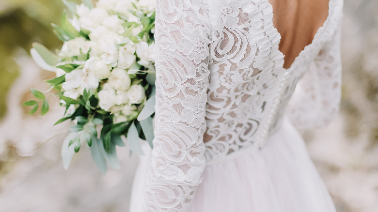 bride holding flowers in gown