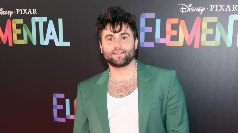 Jake Borelli posing on the red carpet