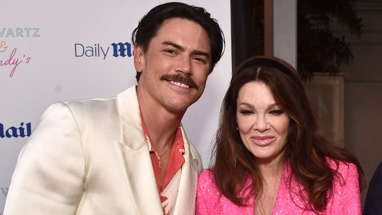 Tom Sandoval and Lisa Vanderpump posing at an event