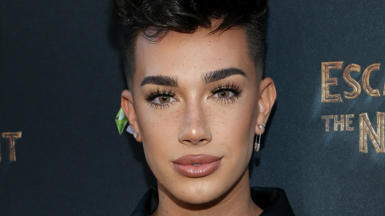 James Charles poses on the red carpet