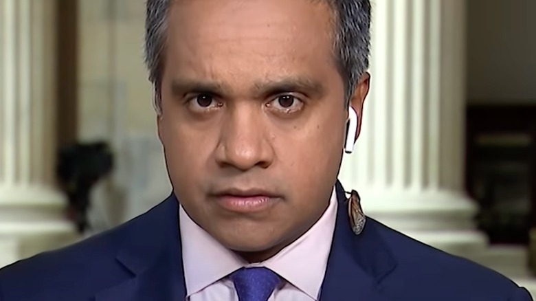 Cicada crawls up CNN correspondent Manu Raju's jacket 