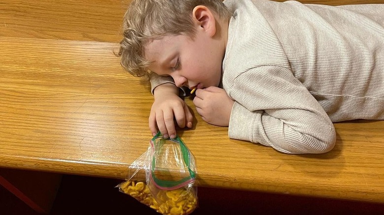 Henry Seewald asleep with goldfish crackers